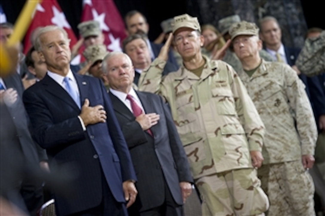 U.S. Vice President Joe Biden, U.S. Defense Secretary Robert M. Gates, U.S. Navy Adm. Mike Mullen, chairman of the Joint Chiefs of Staff, and U.S. Marine Gen. Gen. James N. Mattis, commander, U.S. Central Command, salute during the presentation of colors at the change-of-command ceremony for U.S. Forces Iraq in Baghdad, Sept. 1, 2010. U.S. Army Gen. Lloyd J. Austin III relieved U.S. Army Gen. Raymond T. Odierno.
