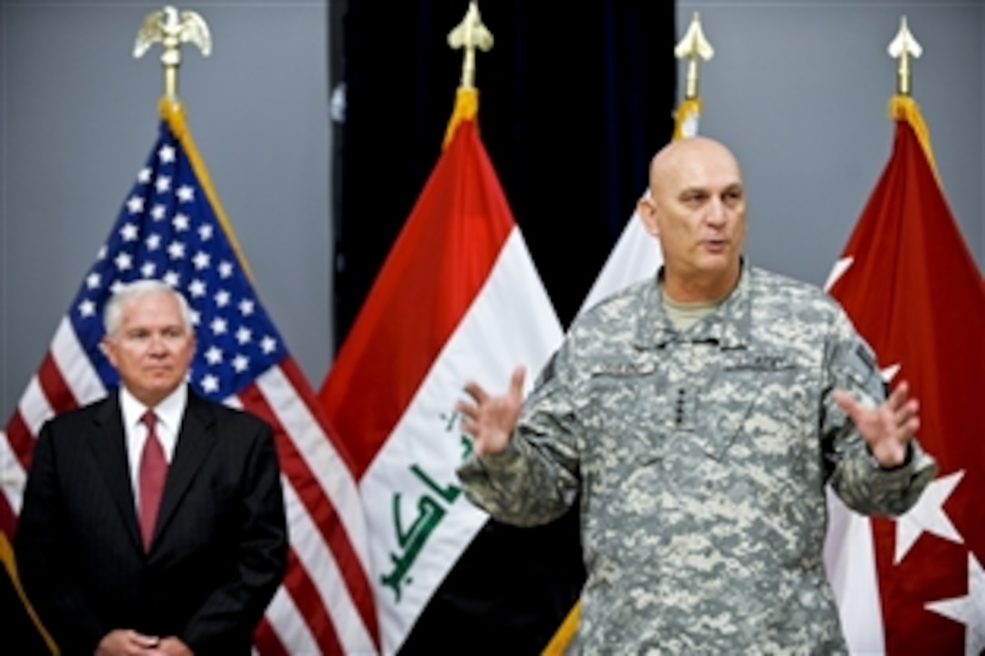 U.S. Army Gen. Raymond T. Odierno thanks members of his staff as U.S. Defense Secretary Robert M. Gates listens during a ceremony to mark the drawdown of forces before Odierno's departure from U.S. Forces Iraq at the al Faw Palace on Camp Victory, Iraq, Sept.1, 2010. 