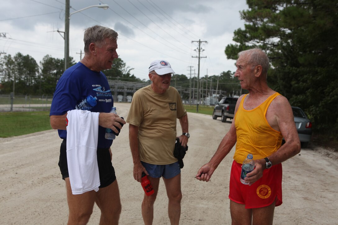 Marathon runners retired Capt. John Germain (left), retired Lt. Col. Jim Rider (center) and retired Sgt. Maj. Domenick Irrera (right), socialize after running in the Marine Corps Community Services’ 5K Labor Day Fun Run aboard Marine Corps Base Camp Lejeune, Sept. 2.  The event was free and provided an opportunity for service members, families, Department of Defense civilians, retired military personnel and a dog to participate in the three-mile race.