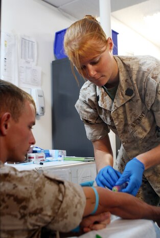 Seaman Rachael Pederson, a corpsman with the Regimental Aid Station, Combat Logistics Regiment 27, 2nd Marine Logistics Group, completes blood work on a patient during a routine health check, Sept. 2, 2010, aboard Camp Lejeune, N.C. Corpsmen, like those with the RAS have the substantial responsibility of keeping Marines and sailors in the regiment healthy and ready to deploy. (U.S. Marine Corps photo by Pfc. Franklin E. Mercado)