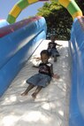 Daniel (front) and Andrew Cooper, sons of MSgt. Jevon D. Cooper, play on the air playground during the Mahalo Bash Sept. 2, 2010, at Joint Base Pearl Harbor-Hickam. The Mahalo Bash is an annual event hosted by the Pacific Air Forces commander to thank Airmen and their families for their service and hard work throughout the year. (U.S. Air Force photo/Tech. Sgt. Matthew McGovern)