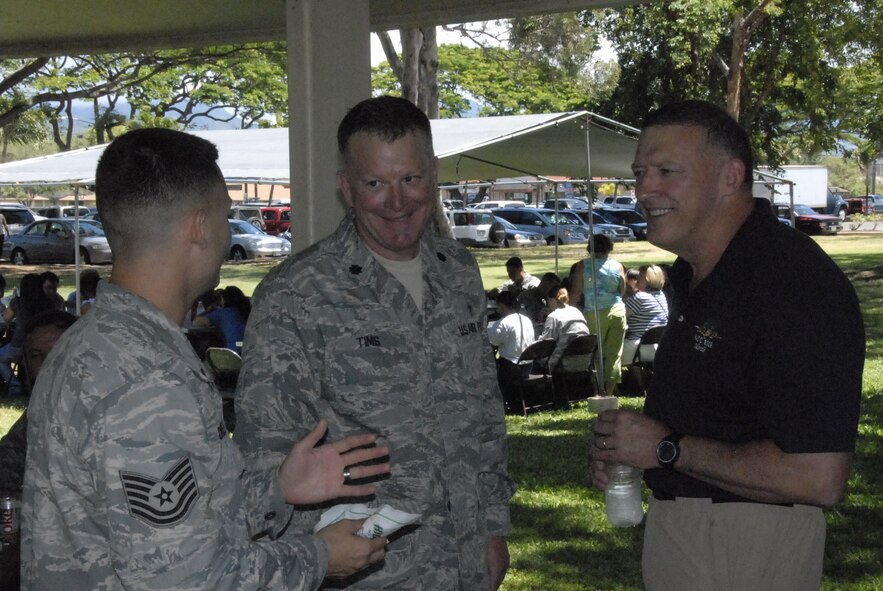Tech. Sgt. Steven Drew (left), the NCOIC of the Pacific Air Forces chaplains office and Lt. Col. James Tims, a PACAF chaplain, talk to Gen. Gary L. North, the commander of PACAF, during the Mahalo Bash Sept. 2, 2010, at Joint Base Pearl Harbor-Hickam. (U.S. Air Force photo/Tech. Sgt. Matthew McGovern)