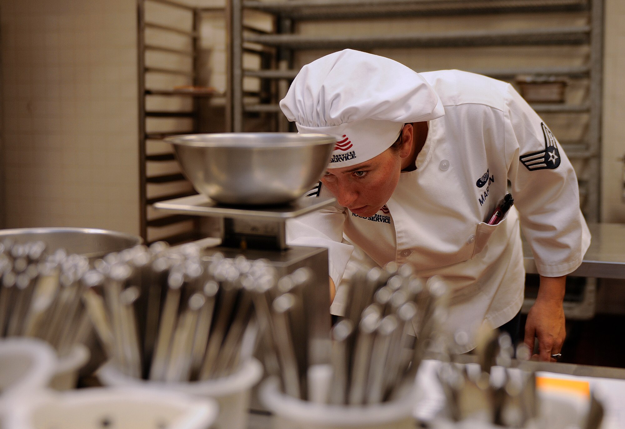 Senior Airmen Carisa Martin, 366th Force Support Squadron bakery, measures flour before preparing desserts at the Wagon Wheel Dining Facility. The DFAC has been closed for renovations since November of 2009. The $2.04 million project made some major changes in several different areas of the facility including new electrical, all new HVAC, new fire alarm components, new interior painting and also the removal of one of the walls to make one large dining area. (U.S. Air Force photo by Senior Air