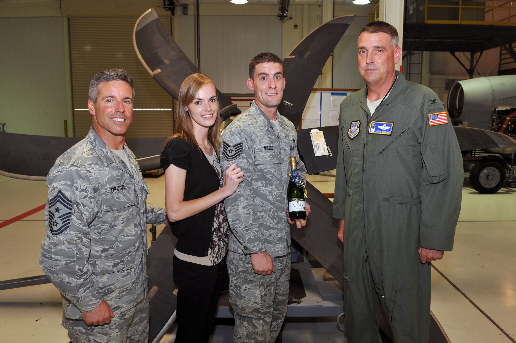 LITTLE ROCK AIR FORCE BASE, Ark -- Staff Sgt. Andrew Wildes, 19th Component Maintenance Squadron aerospace propulsion craftsman, poses for a photo with Chief Master Sgt. David Spector, Air Mobility Command command chief master sergeant, his wife, Jessica, and Col. Michael Minihan, 19th Airlift Wing commander, after he was promoted to technical sergeant through the Stripes for Exceptional Performers program.  (U.S. Air Force photo by Staff Sgt. Chris Willis)