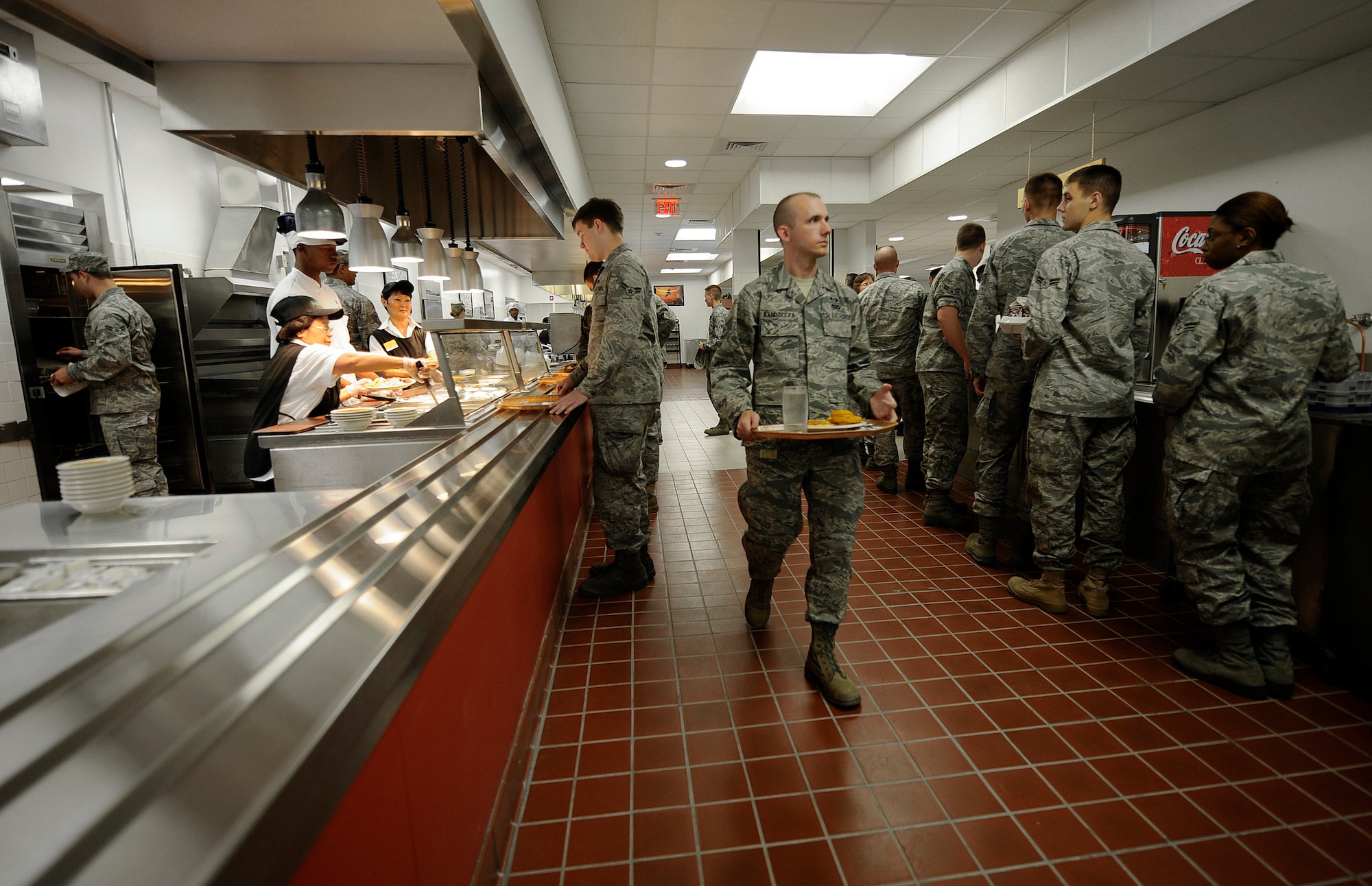 Airmen enjoy a steak and seafood lunch at the Wagon Wheel Dining Facility during the grand re-opening celebration Sept. 1. The DFAC has been closed for renovations since November of 2009. The $2.04 million project made some major changes in several different areas of the facility including new electrical, all new HVAC, new fire alarm components, new interior painting and also the removal of one of the walls to make one large dining area. (U.S. Air Force photo by Senior Airman Renishia Richardson)