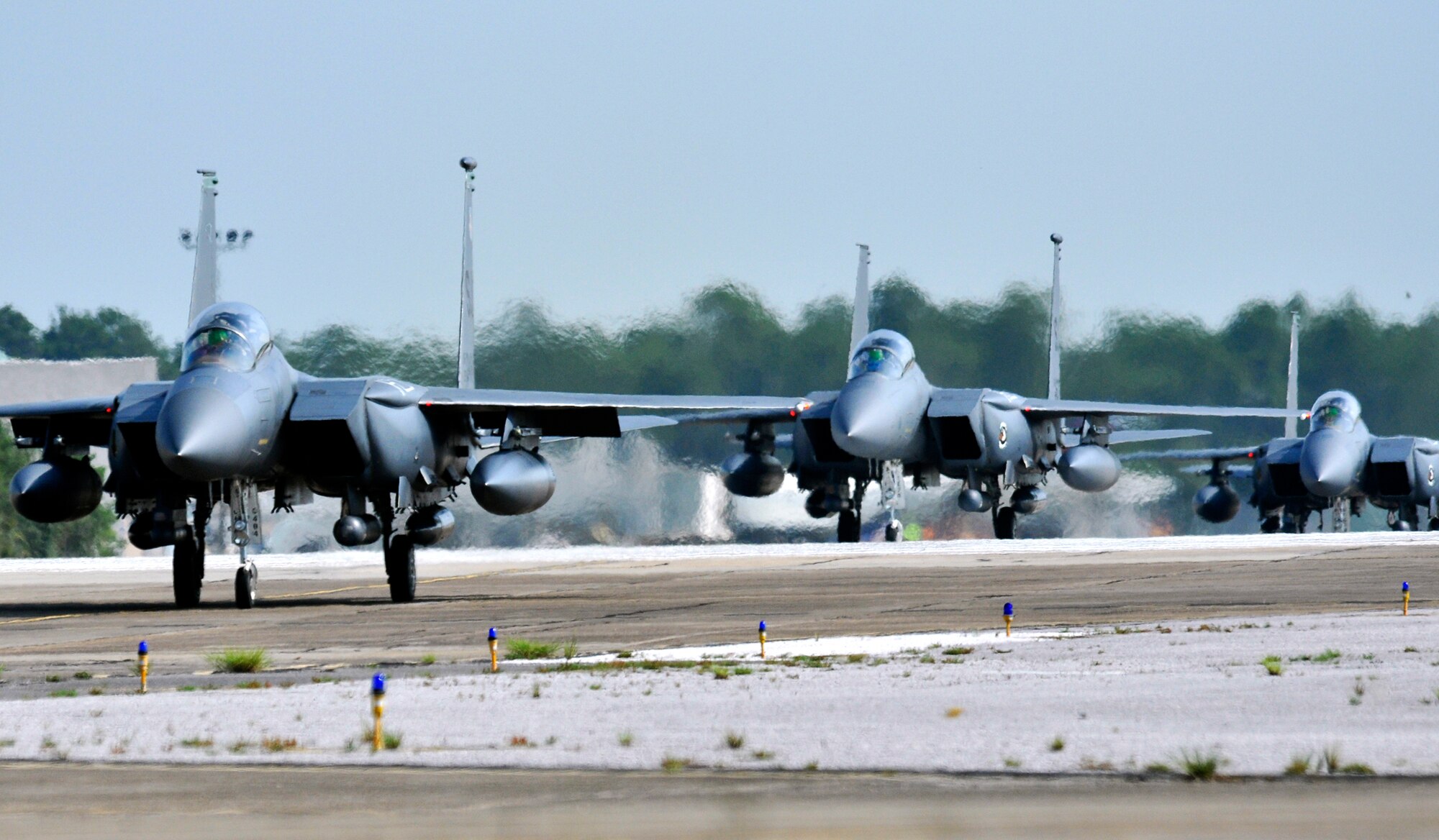 F-15E Strike Eagles from the 4th Fighter Wing taxi in at Eglin Air Force Base Fla., Sept. 2 as part of a hurricane evacuation from Seymour Johnson AFB, N.C.  Approximately 30 Strike Eagles, three KC-135 Stratotankers and 300 personnel arrived to beddown the aircraft as Hurricane Earl headed for the N.C. coast.  The 33rd Fighter Wing, a former F-15 unit now the training wing for the F-35 Lightning II, provided flightline space for the aircraft.  (U.S. Air Force photo/Samuel King Jr.)