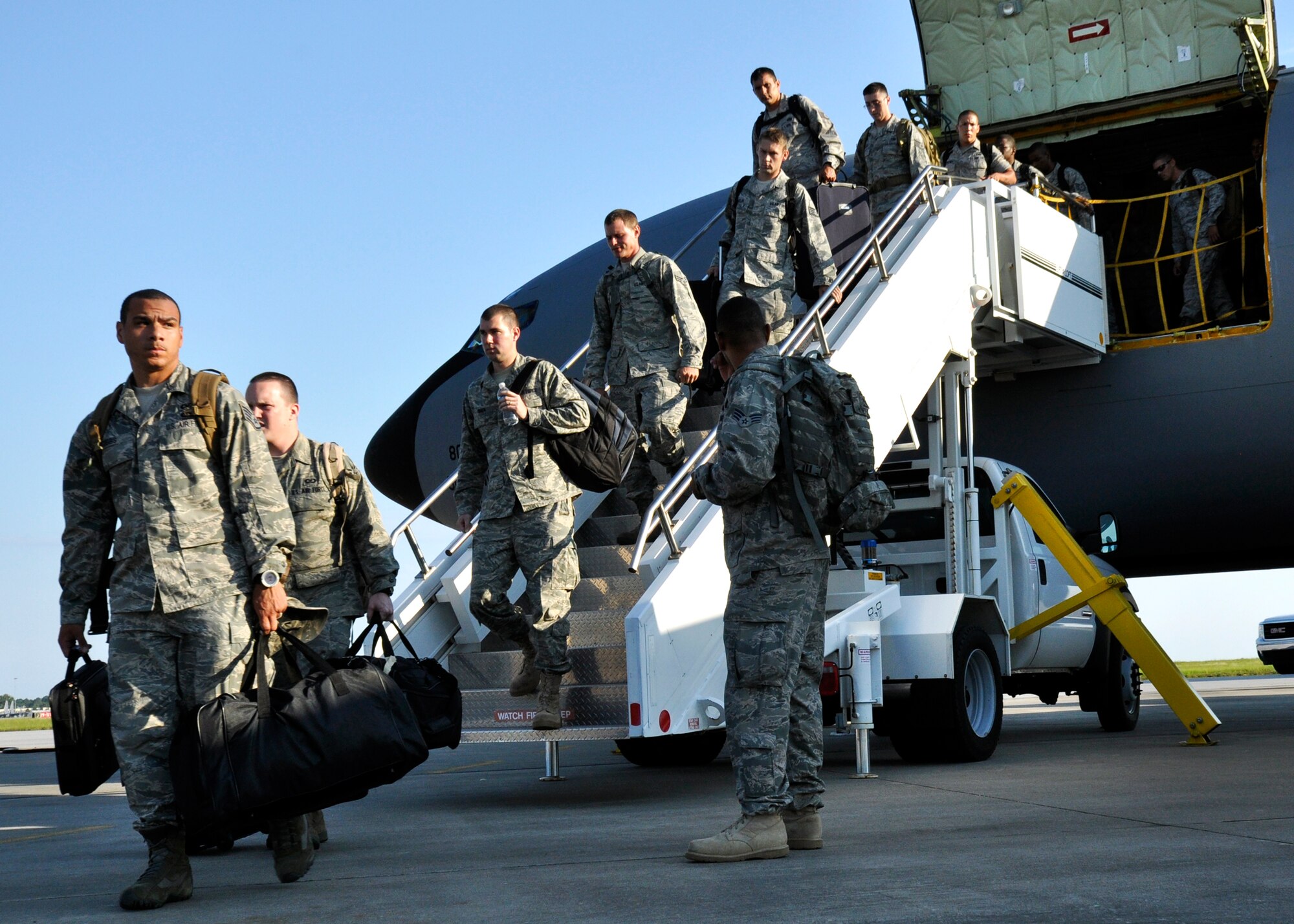 Maintainers and security forces Airmen from the 4th Fighter Wing disembark the KC-135 Stratotanker after arriving to Eglin Air Force Base Fla., Sept. 1 as part of a hurricane evacuation from Seymour Johnson AFB, N.C.  Approximately 30 F-15E Strike Eagles, three KC-135s, and 300 personnel arrived to beddown the aircraft as Hurricane Earl headed for the N.C. coast.  The 33rd Fighter Wing, a former F-15 unit now the training wing for the F-35 Lightning II, provided flightline space for the aircraft.  (U.S. Air Force photo/Samuel King Jr.)