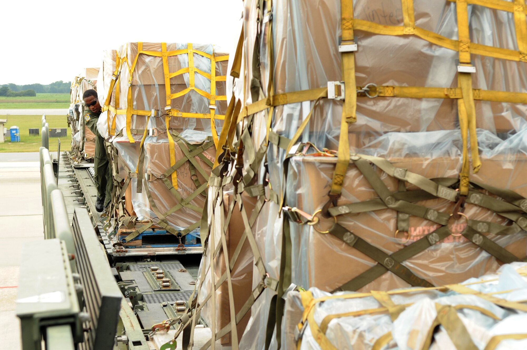 SEYMOUR JOHNSON AIR FORCE BASE, N.C. – Staff Sgt. Devon Jarvis presets humanitarian supplies for easy loading onto a KC-10 Extender here, Sept. 2, 2010. Airmen from Joint Base McGuire-Dix-Lakehurst, N.J., arrived here to pick up donations from the Goldsboro community, collected through the MERCI Center, for transportation to Afghanistan. Sergeant Jarvis, 76th Air Refueling Squadron boom operator, is from MontClair, N.J. (U.S. Air Force photo/Staff Sergeant Courtney Richardson) (RELEASED)