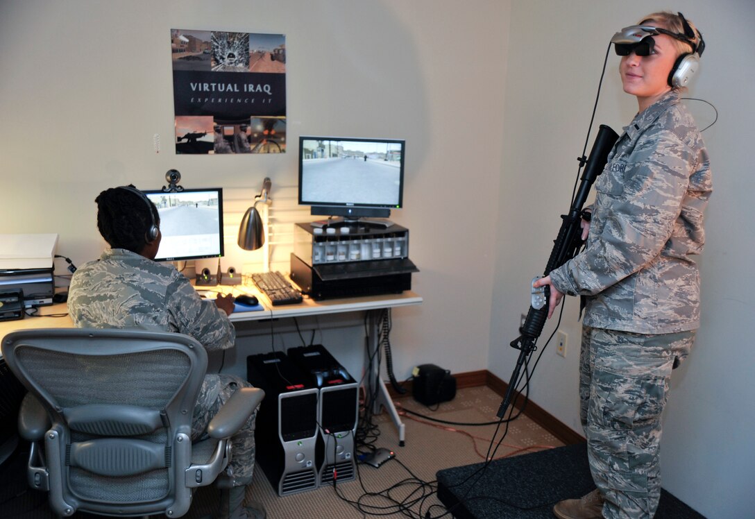 JOINT BASE ANDREWS, Md. -- First Lt. Margot Capell, 316th Wing joint Base Andrews commander’s executive, takes a tour through the Virtual Iraq experience at Malcolm Grow Medical Center Aug. 27.  Members of the 779th use the virtual reality system to treat patients with Post Traumatic Stress Disorder by allowing them to revisit situations to help them through the anxiety of what they endured.  (U.S. Air Force photo by Staff Sgt. Christopher Marasky)