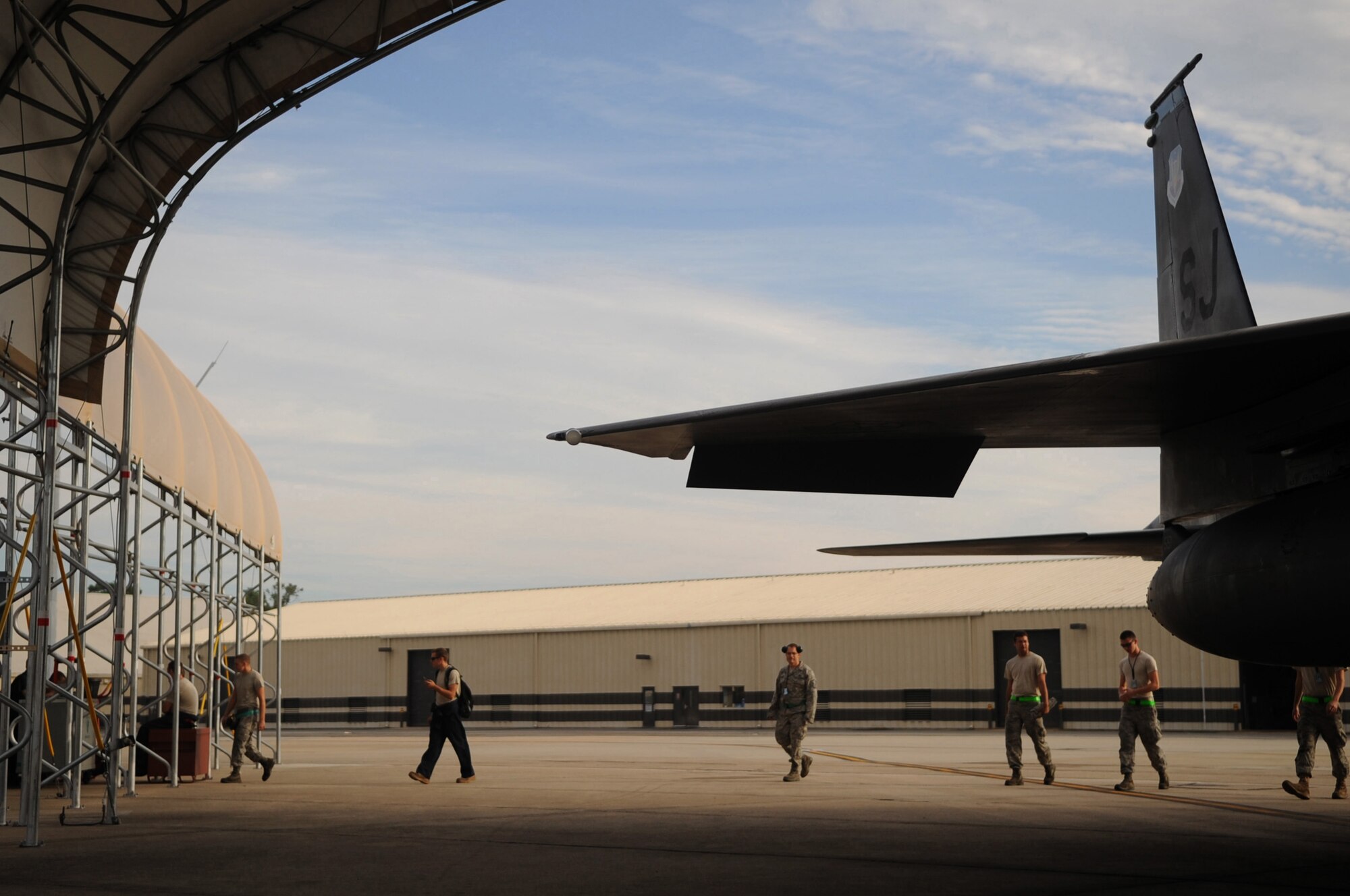 SEYMOUR JOHNSON AIR FORCE BASE, N.C. -- Airmen of the 4th Fighter Wing's 335th Fighter Squadron conduct a foreign object debris walk prior to the departure of assigned F-15E Strike Eagles, in preparation for Hurricane Earl Sept. 2, 2010. A FOD walk is initiated before aircraft take-off and land to identify objects such as ice, birds, tools, hardware, and other items that could potentially destroy a jet engine. (U.S. Air Force photo/Senior Airman Makenzie Lang)(RELEASED)