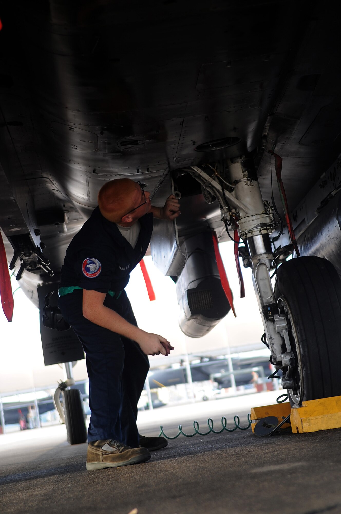 SEYMOUR JOHNSON AIR FORCE BASE, N.C. -- Airman 1st Class Joshua Maley performs a pre-flight check on an F-15E Strike Eagle before departure to Eglin Air Force Base, Fla. in preparation for Hurricane Earl here, Sept. 2, 2010. During pre-flight inspections Airmen checked the aircraft's general condition and ensures no maintenance is required. Airman Maley, 335th Fighter Squadron crew chief, is from Akron, Ohio. (U.S. Air Force photo/Senior Airman Makenzie Lang)(RELEASED)