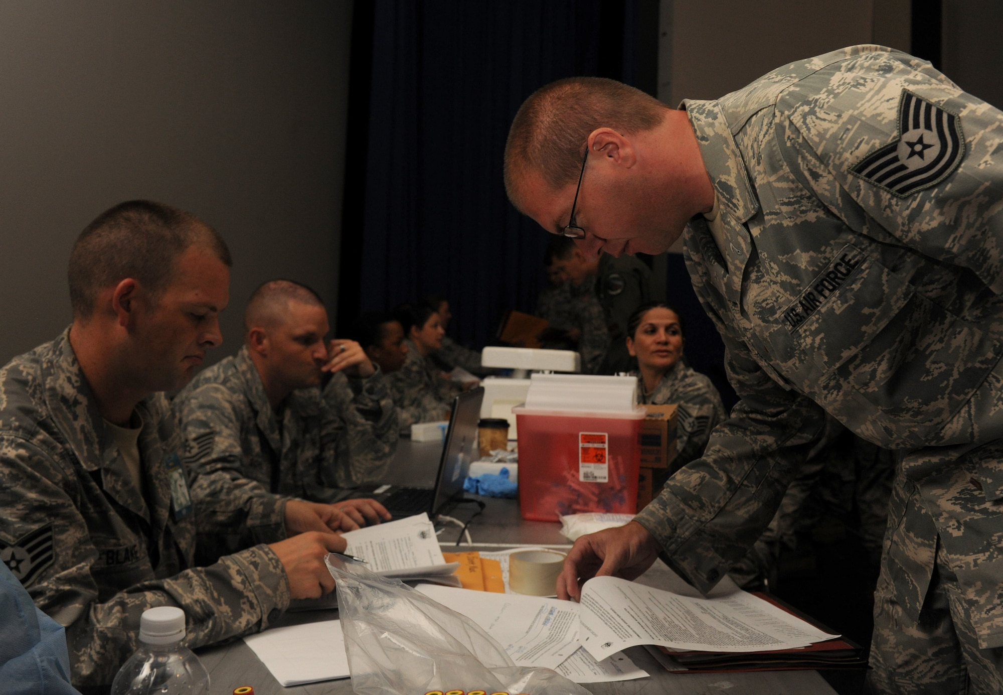 MOODY AIR FORCE BASE, Ga. -- Tech. Sgt. Anthony Bonham, 476th Maintenance Squadron, checks in with his medical records while processing a deployment line here Aug. 24. His upcoming deployment as part of the 476th Fighter Group marks the highest number of Reserve personnel to deploy with the 23rd Fighter Group since the Total Force Integration initiative in 2007. (U.S. Air Force photo/Airman 1st Class Benjamin Wiseman)