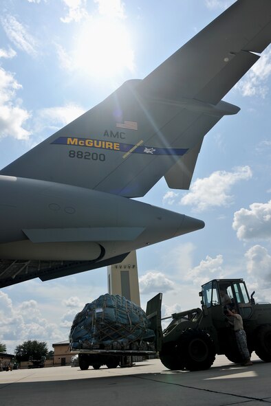 MOODY AIR FORCE BASE, Ga. -- A tractor from the 23rd Logistic Readiness Squadron loads equipment onto the back of a C-17 Globemaster III here Aug 26. Airmen from the 23rd LRS load the C-17 in preparation for a deployment for members from the 347th Rescue Group. (U.S. Air Force photo/Airman 1st Class Joshua Green)
