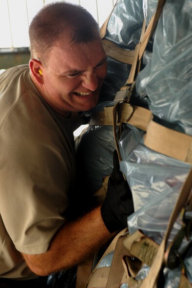 MOODY AIR FORCE BASE, Ga. -- Master Sgt. Michael DunBlazer, 23rd Logistic Readiness Squadron fuels compliance and environmental section chief, assist in loading a C-17 Globemaster III here Aug. 26. The C-17 was loaded with personnel from the 347th Rescue Group and cargo from Moody. (U.S. Air Force photo/ Airman 1st Class Benjamin Wiseman)
