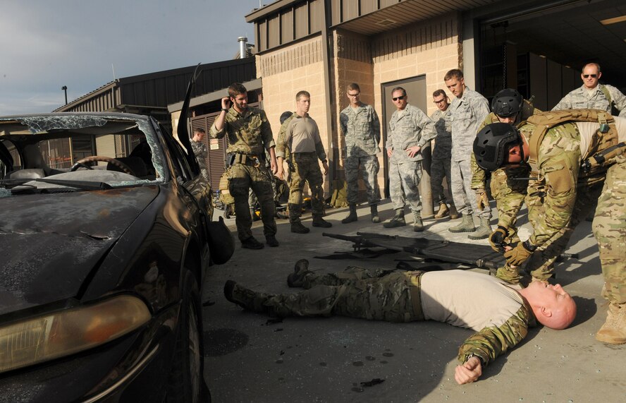 MOODY AIR FORCE BASE, Ga. -- Members from the 38th Rescue Squadron run a confined spaces training demonstration for Maj. Gen. David Goldfein, Air Combat Command director of Air and Space Operations, during a visit to Moody Air Force Base, Ga., Aug. 31. The general participated in the mock rescue, which simulated freeing a trapped vicitim beneath a vehicle. (U.S. Air Force photo/Airman 1st Class Benjamin Wiseman) 