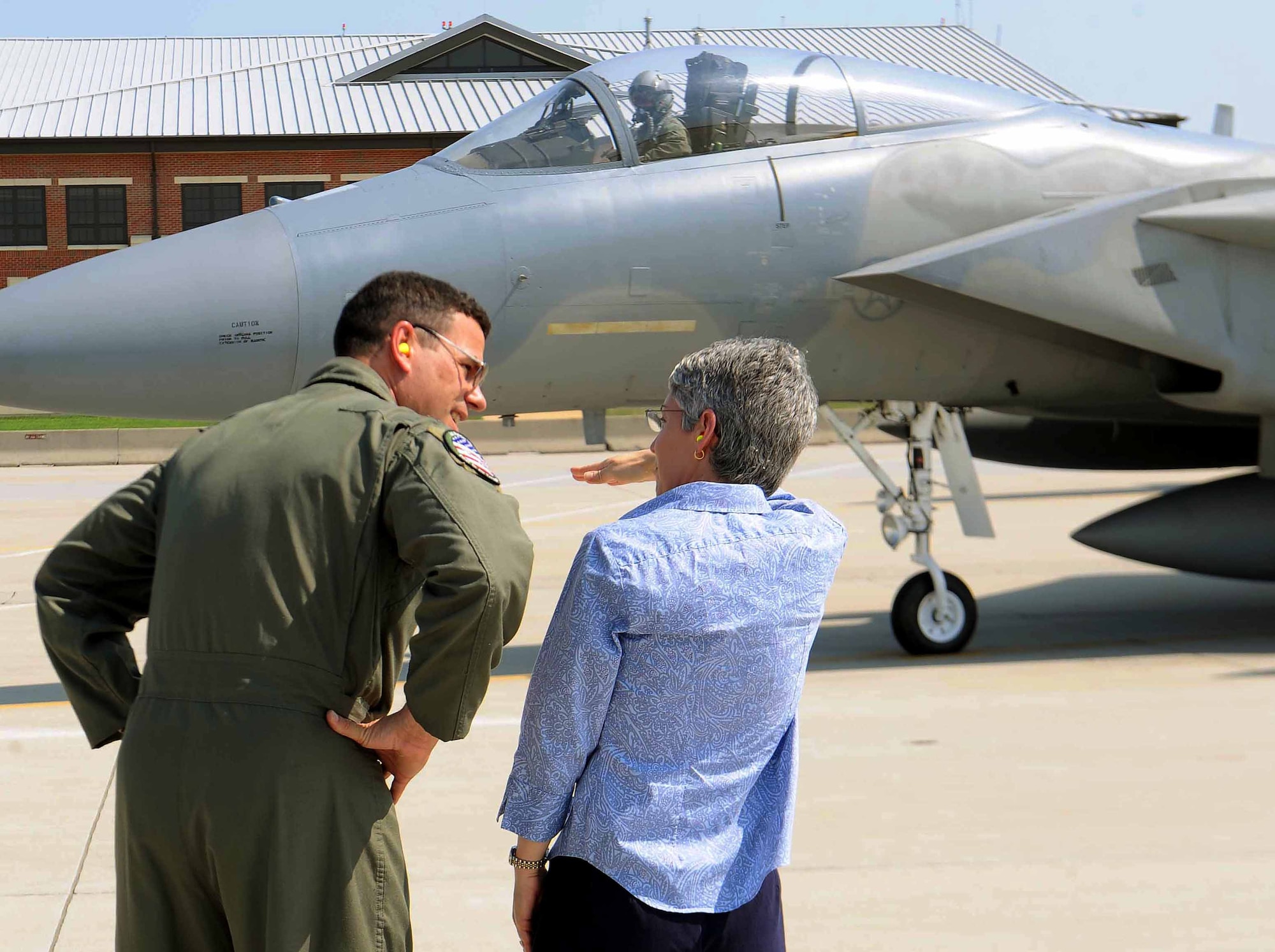 LANGLEY AIR FORCE BASE, Va.— Col. Matt Molloy, 1st Fighter Wing commander, explains fighter squadron operations to Mrs. Terri Morris Sep 1.  As a schoolgirl in 1976, Mrs. Morris won a contest to name the first Eagle stationed at Langley, “Peninsula Patriot.”  (U.S. Air Force photo/Master Sgt. Anna Hayman)(RELEASED)