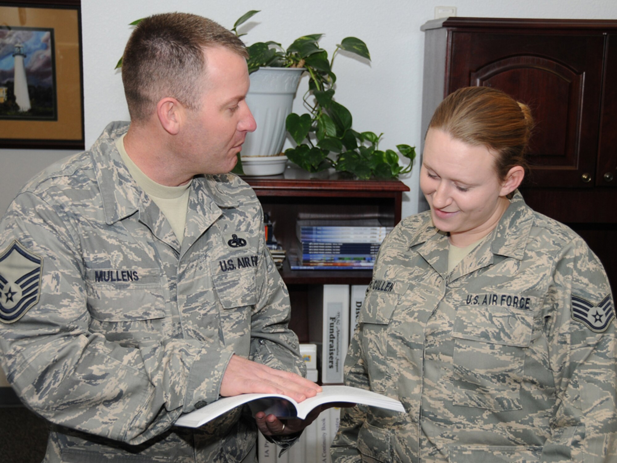 Sergeant Mullens discusses the retraining window with Staff Sgt. April Cullen, 81st Mission Support Group.  (U.S. Air Force photo by Kemberly Groue)