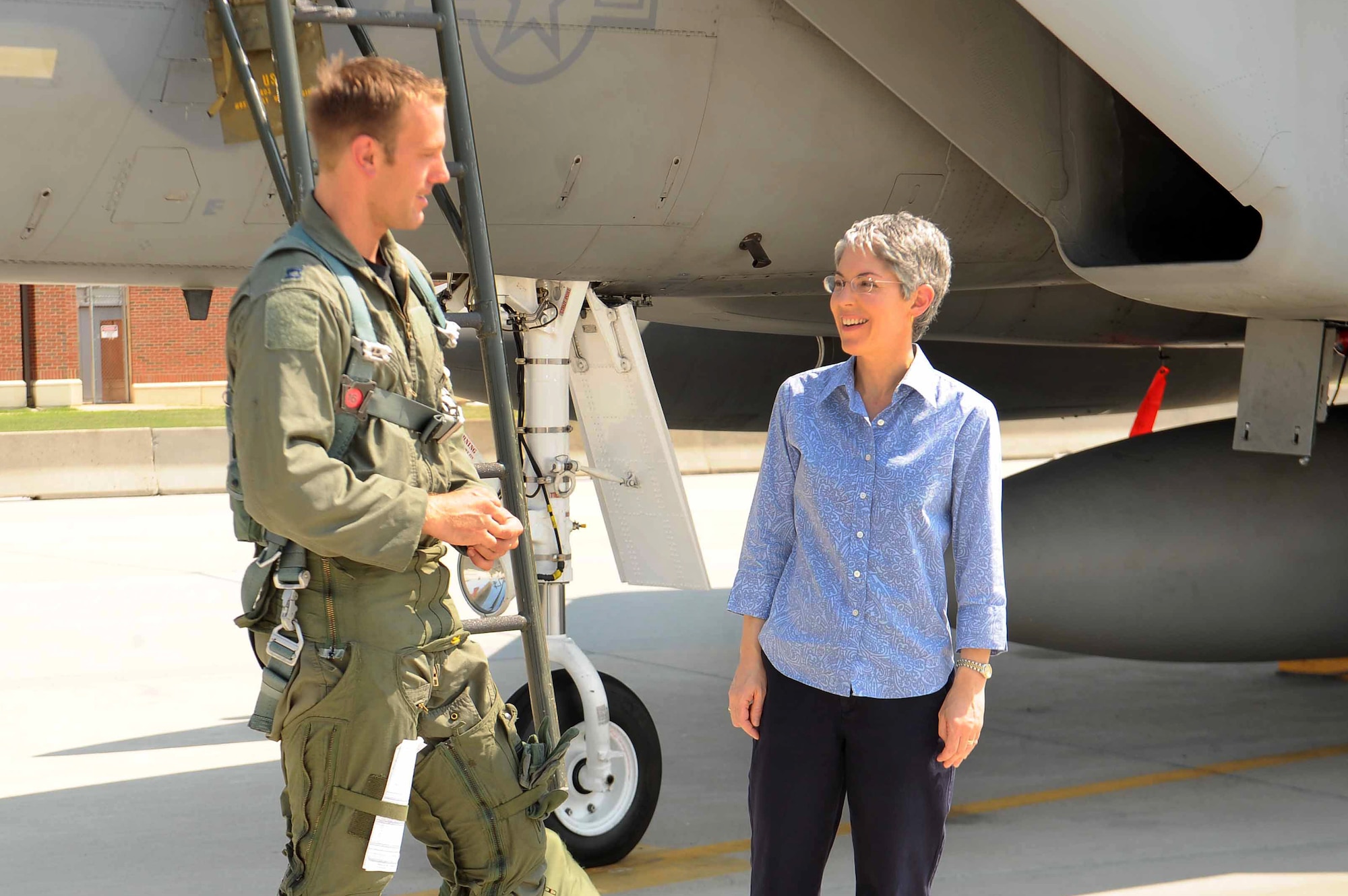 LANGLEY AIR FORCE BASE, Va.—Capt. Brent Tittle, 71st Fighter Squadron pilot, speaks with Mrs. Terri Morris in front of the final F-15 Eagle before it’s departure Sept. 1.  As a schoolgirl in 1976, Mrs. Morris won a contest to name the first Eagle stationed at Langley, “Peninsula Patriot.”  (U.S. Air Force photo/Master Sgt. Anna Hayman)(RELEASED)