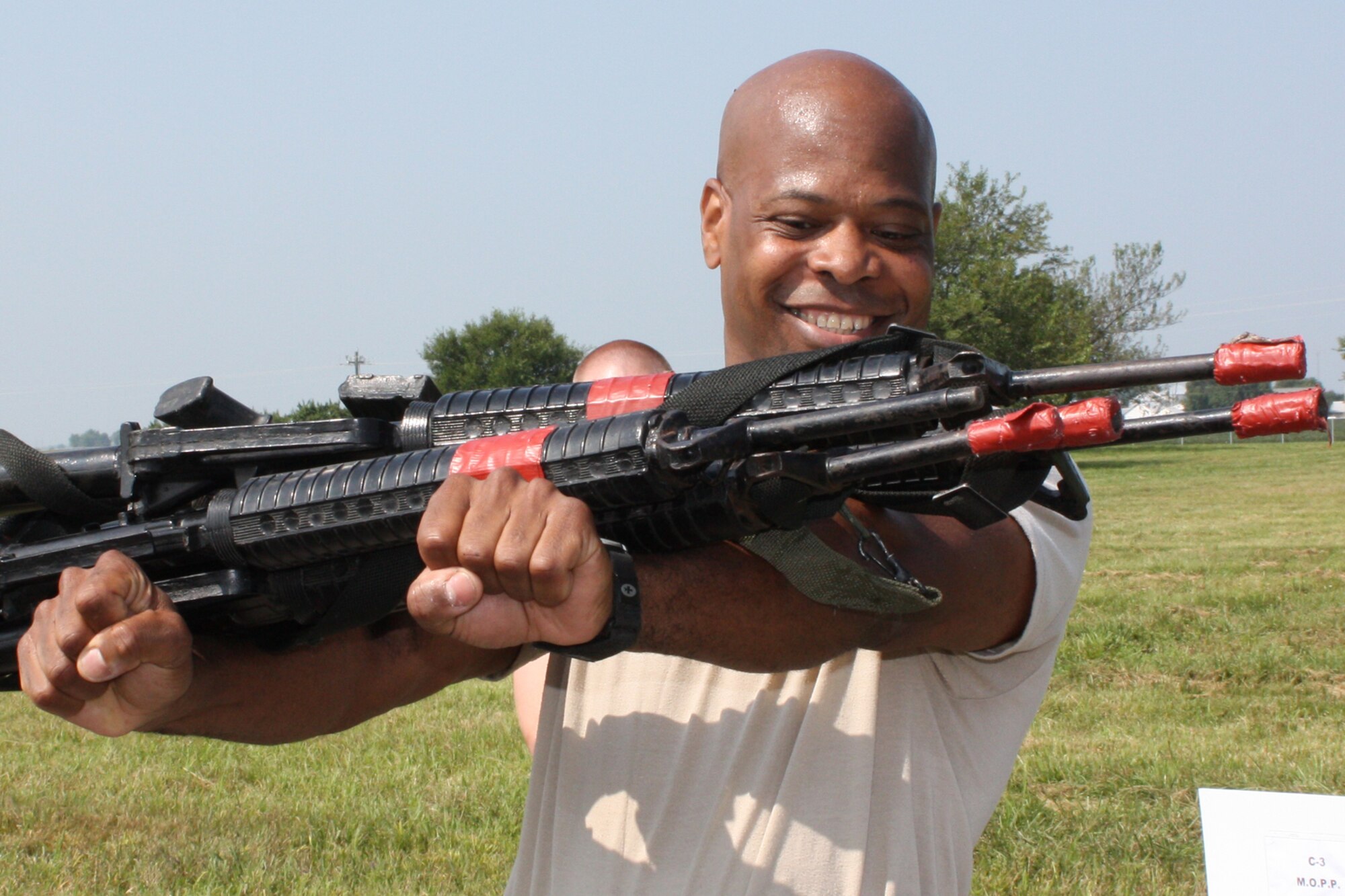 GRISSOM AIR RESERVE BASE, Ind., -- Tech. Sgt. Steven Hayes, a combat arms specialist with the 434th Security Forces Squadron, balances a M16 rifles on his forearms during a friendly competition among fire teams on the August unit training assembly. The competition was done as part of land navigation training for the security members.  (U.S. Air Force photo/Master Sgt. Wayne Svantner)