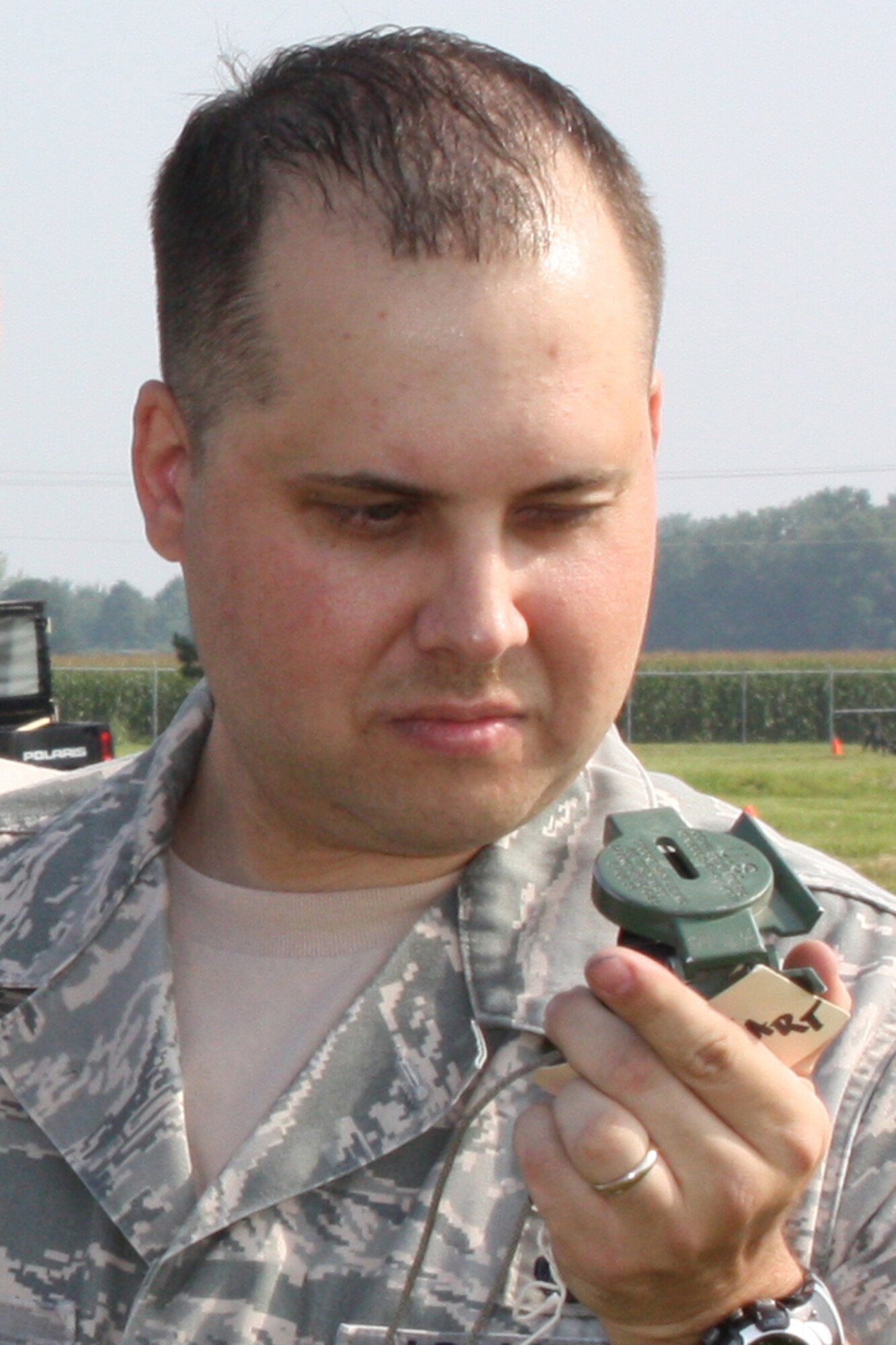 GRISSOM AIR RESERVE BASE, Ind., -- Staff Sgt. Michael Hoffarth, a fire team member with the 434th Security Forces Squadron, looks at a compass heading during a land navigation exercise held during the August unit training assembly.  (U.S. Air Force photo/Master Sgt. Wayne Svantner)