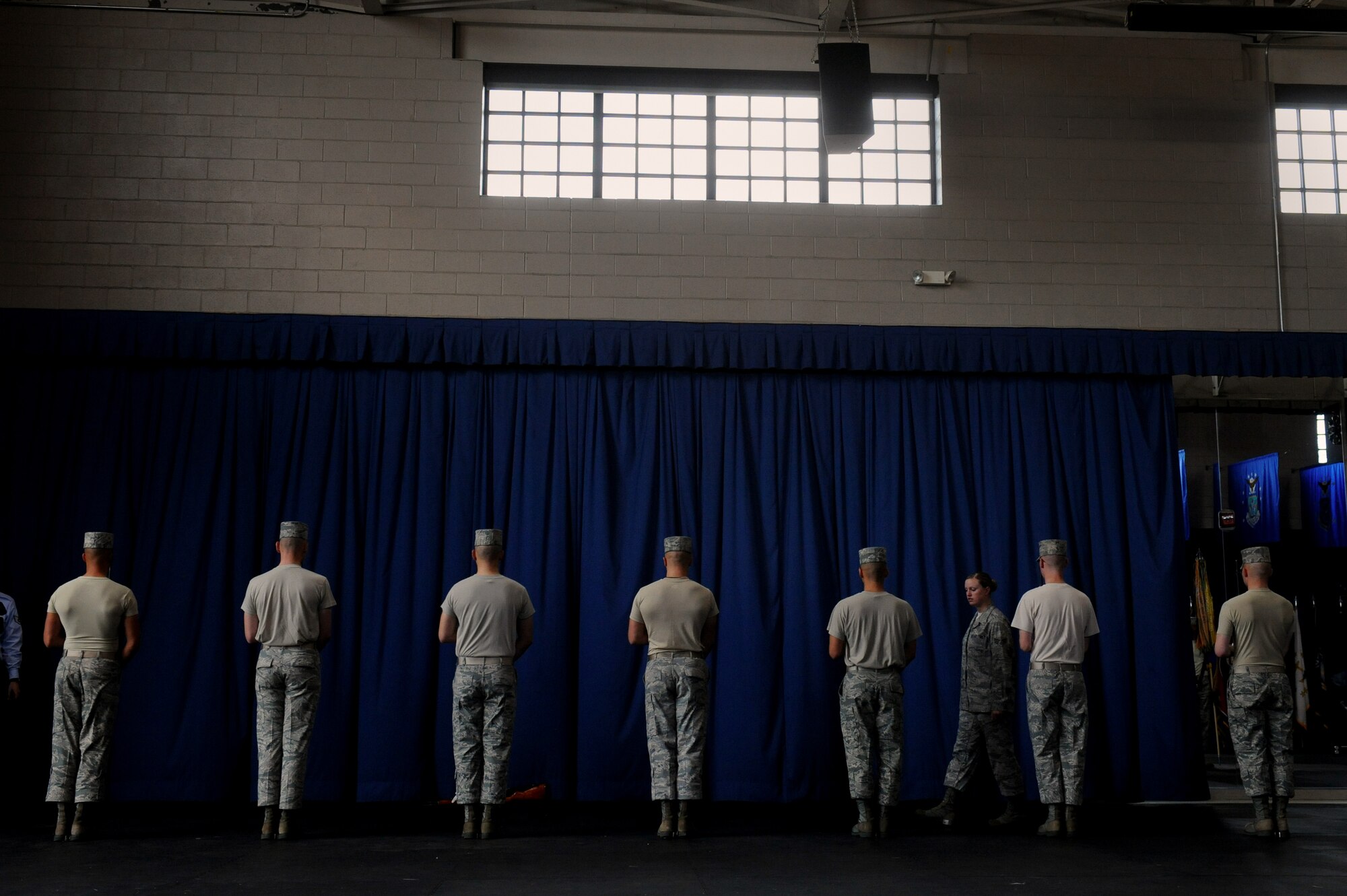 BOLLING AFB, D.C. -- Senior Airman Maddie Baker, Air Force Honor Guard firing party trainer, watches as firing team members rehearse the rendering of proper honors here Aug. 23. Members perform rigorous practices daily to ensure they perform flawlessly. (U.S. Air Force photo/Staff Sgt. Gina Chiaverotti-Paige)