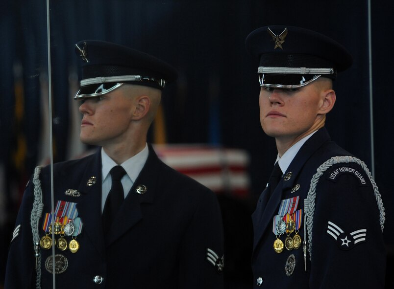 BOLLING AFB, D.C. -- A member of the Air Force Honor Guard looks away after checking his uniform in the mirror here Aug. 23. Members of the Honor Guard must always uphold exemplary personal appearance standards and uniform regulations. (U.S. Air Force photo/Staff Sgt. Gina Chiaverotti-Paige)