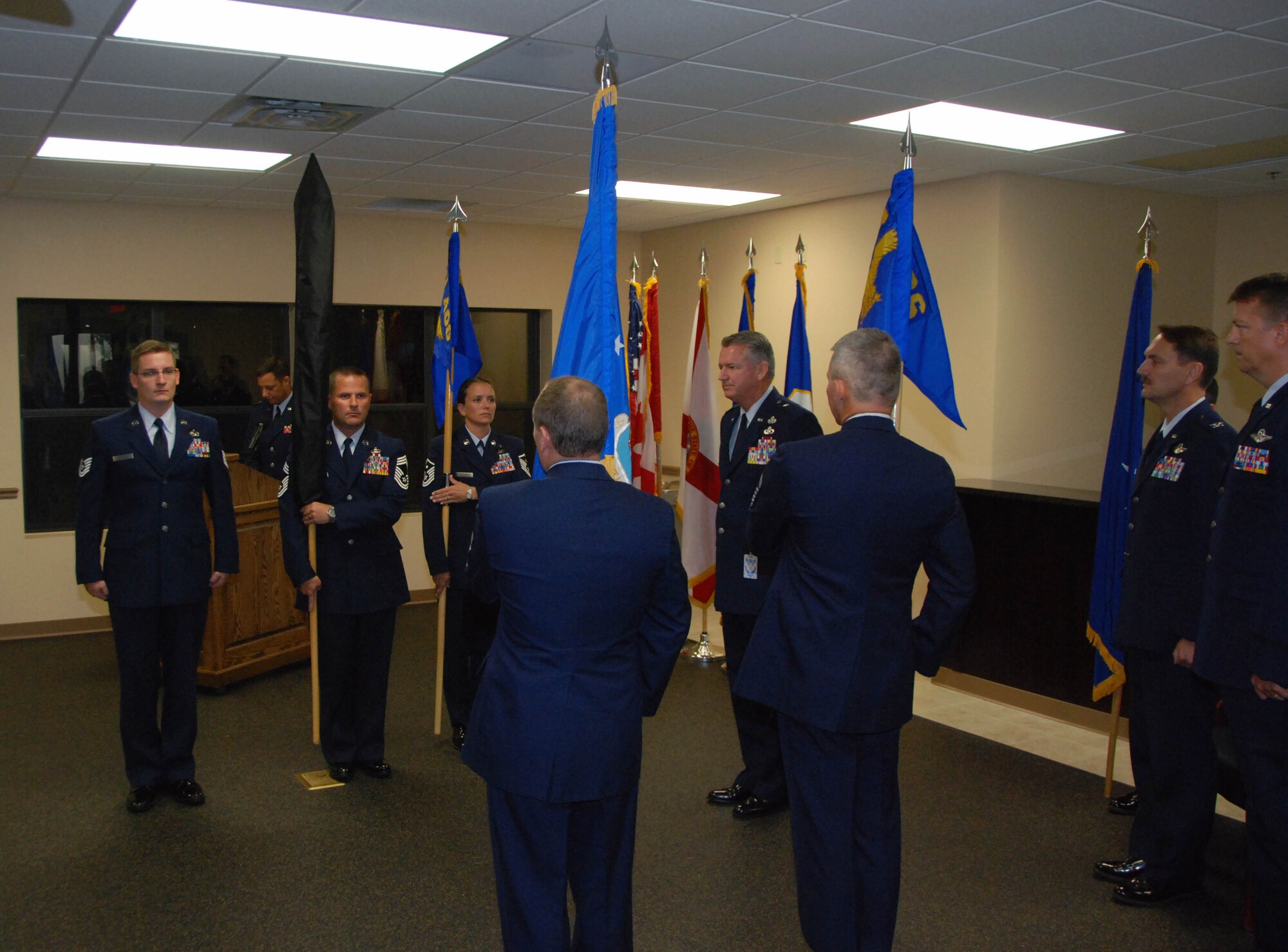 (From left to right, facing) Tech. Sgt. Michael Squier, Chief Master Sgt. Lynn Boop, Master Sgt. Tiffiney Kellum, Brig. Gen. Joseph Balskus, Col. Scott Barberides, Col. Randy Spear, (and in foreground) Chief Master Sgt. Ewell Griswold and Senior Master Sgt. Billie Statom, participate in the presentation of the guidon of the newly formed 101st Air & Space Operations Group (formerly known as Southeast Air Defense Sector) at a ceremony Aug. 21, 2010 at Tyndall Air Force Base, Fla.  (U.S. Air Force photo by Capt. Jared Scott)