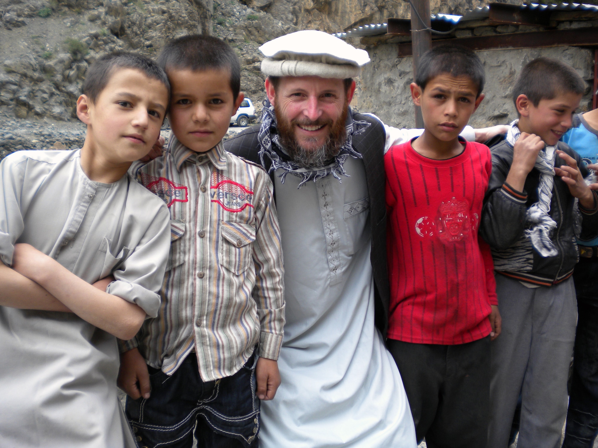 Lt. Col. Patrick Donley visits one of the villages near Kabul, Afghanistan, during his recent deployment. Colonel Donley received a Bronze Star for his efforts as an adviser for the Ministry of Rural Rehabilitation and Development. He wore local civilian attire and a beard for his unique mission. (Courtesy Photo)