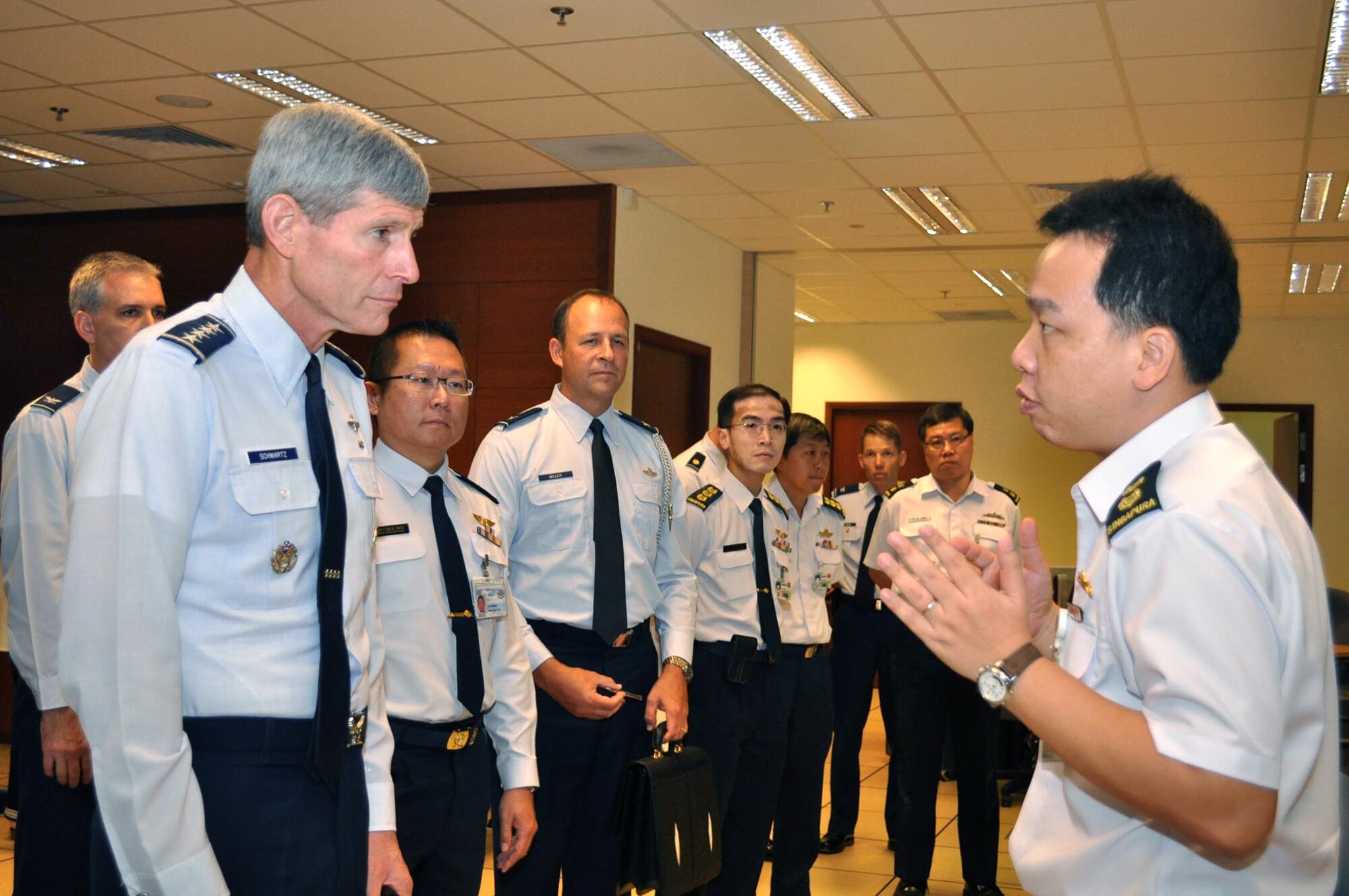 Air Force Chief of Staff Gen. Norton Schwartz listens to a briefing from Singapore navy Lt. Col. Lim Chye Khiang Aug. 23, 2010, about the Information Fusion Centre, a maritime command center at the Changi Command and Control Center in Singapore. While on the tour, the general was also briefed on Pacific Endeavor, a U.S. Pacific Command humanitarian communication workshop with 16 Asia-Pacific nations, non-governmental organizations and private industry. (U.S. Navy photo/Lt. Theresa Donnelly)