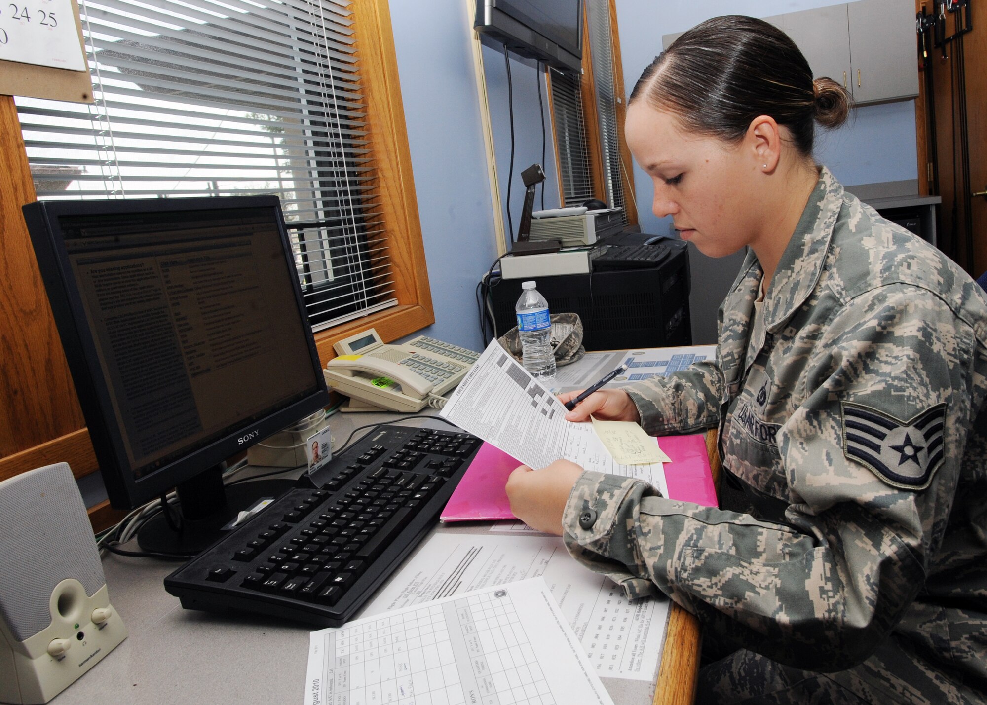 Staff Sgt. Myshel Rush, 22nd Operations Support Squadron airfield management operations supervisor, reviews a shift checklist of Airmen’s schedules Aug. 31, 2010, McConnell Air Force Base, Kan.  The airfield management flight conducts 24-hour shifts to ensure McConnell’s runways and taxiways are operating efficiently to meet mission requirements.  The flight also acts as secondary responders for the removal of wildlife on or near airfields to help reduce aircraft mishaps and loss of life.  (U.S. Air Force photo/Airman 1st Class Andrea Salazar)