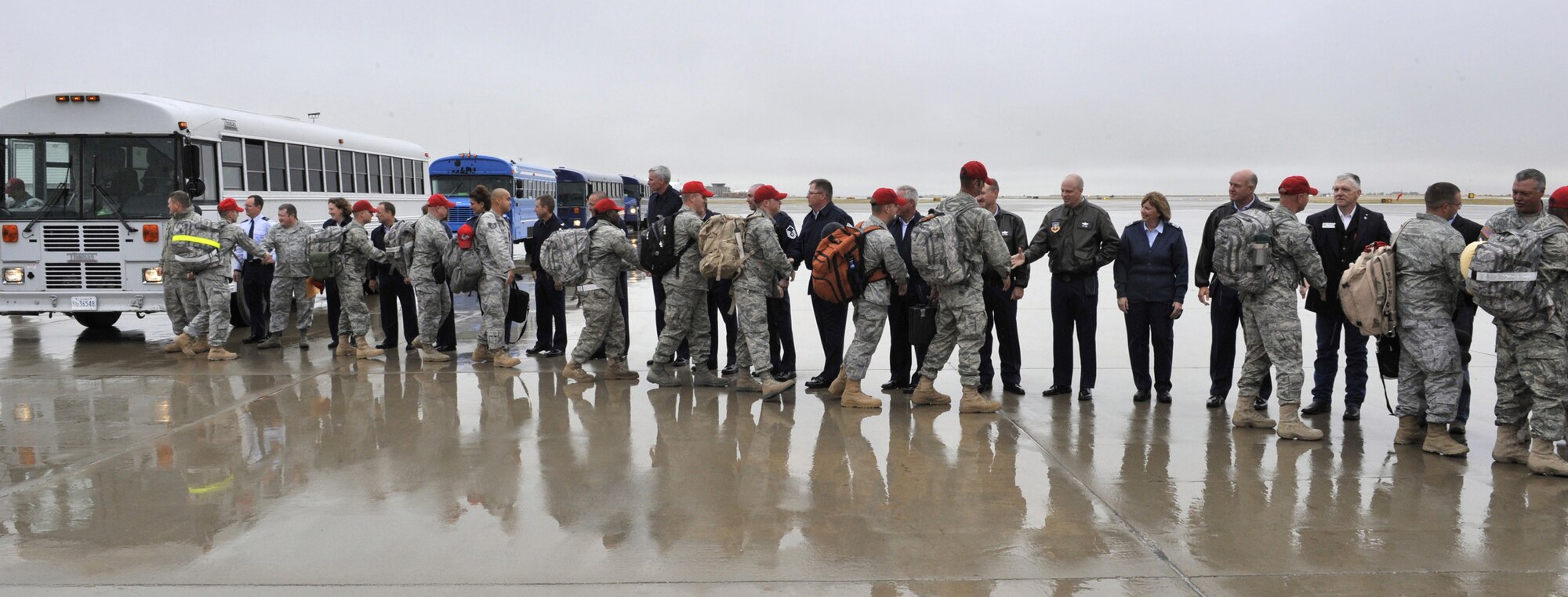 Members of leadership from the Montana Air National Guard as well as elected officals lined the tarmac near Hollman Aviation Aug. 30 to send off a group of more than 300 Airmen from teh 819th and 219th RED HORSE Squadrond deploying to Southwest Asia. (U.S. Air Force photo/John Turner)