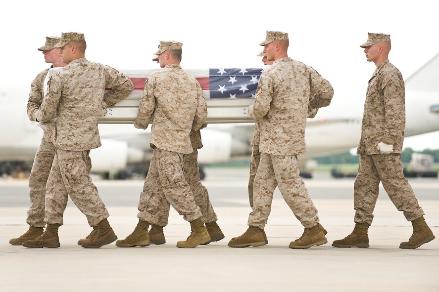 A U.S. Marine Corps team transfers the remains of Marine Corps Sgt. Ronald A. Rodriguez, of Falls Church, Va., at Dover Air Force Base, Del., August 24. Sgt. Rodriguez was assigned to 1st Battalion, 11th Marine Regiment, 1st Marine Division, I Marine Expeditionary Force, Camp Pendleton, Calif.  (U.S. Air Force photo/Roland Balik)