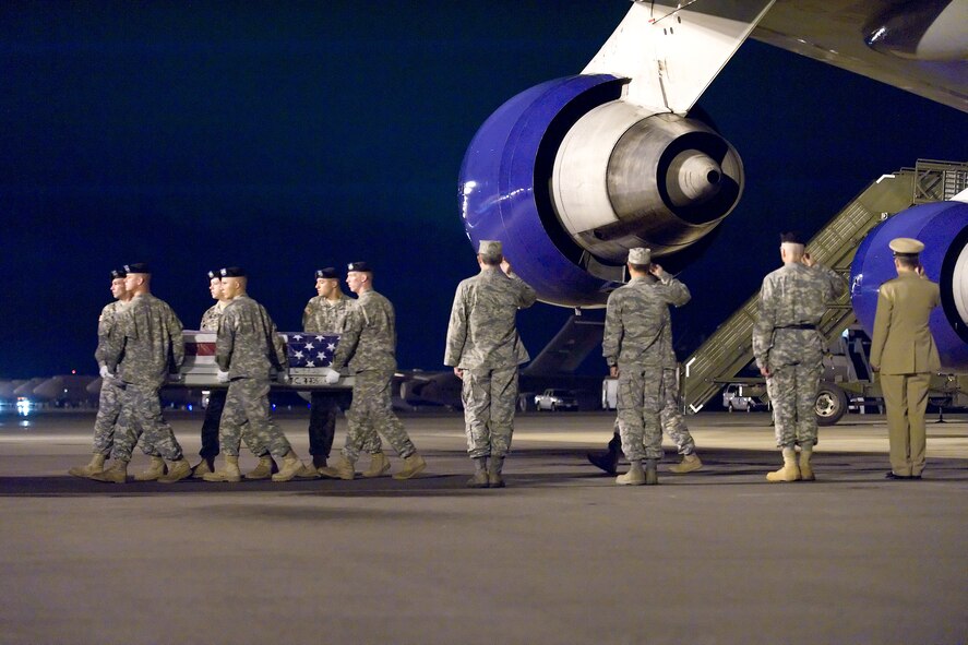 A U.S. Army carry team transfers the remains of Army Sgt. Steven J. Deluzio, of South Glastonbury, Conn., at Dover Air Force Base, Del., August 24. Sgt. Deluzio was assigned to the 172nd Infantry, 86th Infantry Brigade Combat Team, Jericho, Vt. (U.S. Air Force photo/Roland Balik)
