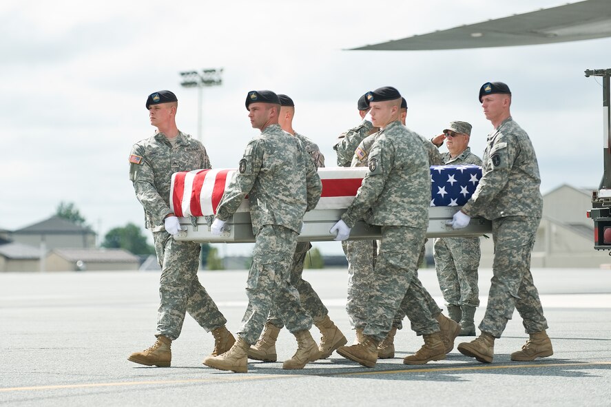 A U.S. Army carry team transfers the remains of Army Spc. Pedro A. Millet Meletiche, of Elizabeth, N.J., at Dover Air Force Base, Del., August 24. Spc. Millet Meletiche was assigned to the 1st Battalion, 66th Armor Regiment, 1st Brigade Combat Team, 4th Infantry Division, Fort Carson, Colo. (U.S. Air Force photo/Roland Balik)