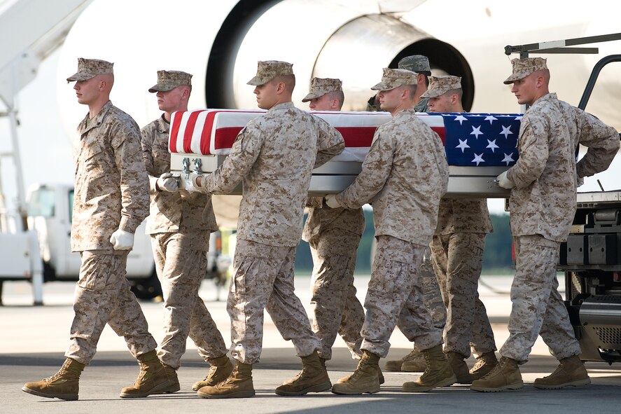 A U.S. Marine Corps team transfers the remains of Marine Corps Lance Cpl. Nathaniel J. Schultz, of Safety Harbor, Fla., at Dover Air Force Base, Del., August 23. Lance Cpl. Schultz was assigned to 2nd Battalion, 6th Marine Regiment, 2nd Marine Division, II Marine Expeditionary Force, Camp Lejeune, N.C.  (U.S. Air Force photo/Roland Balik)