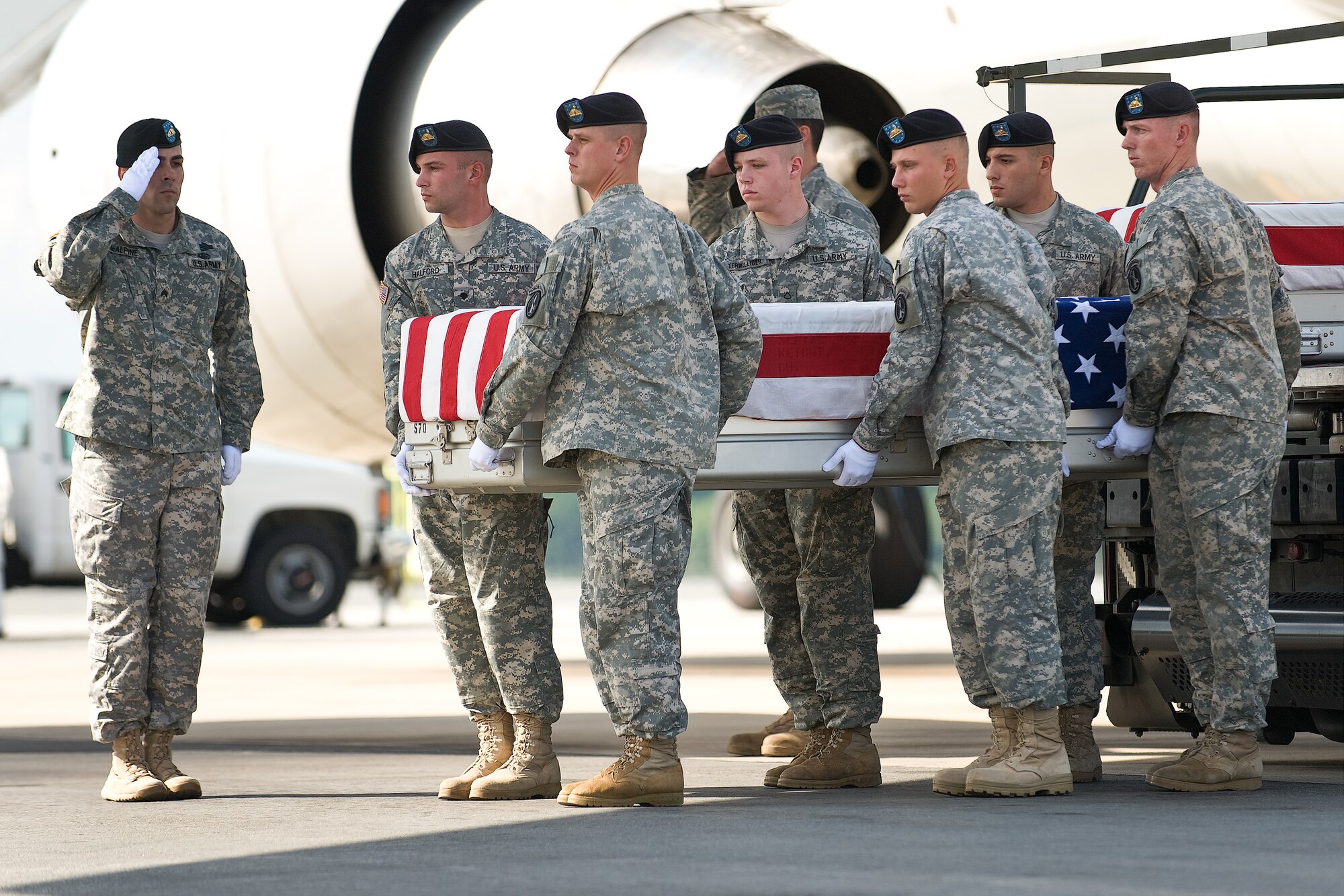 A U.S. Army carry team transfers the remains of Army Sgt. Brandon E. Maggart, of Kirksville, Mo., at Dover Air Force Base, Del., August 23. (U.S. Air Force photo/Roland Balik)