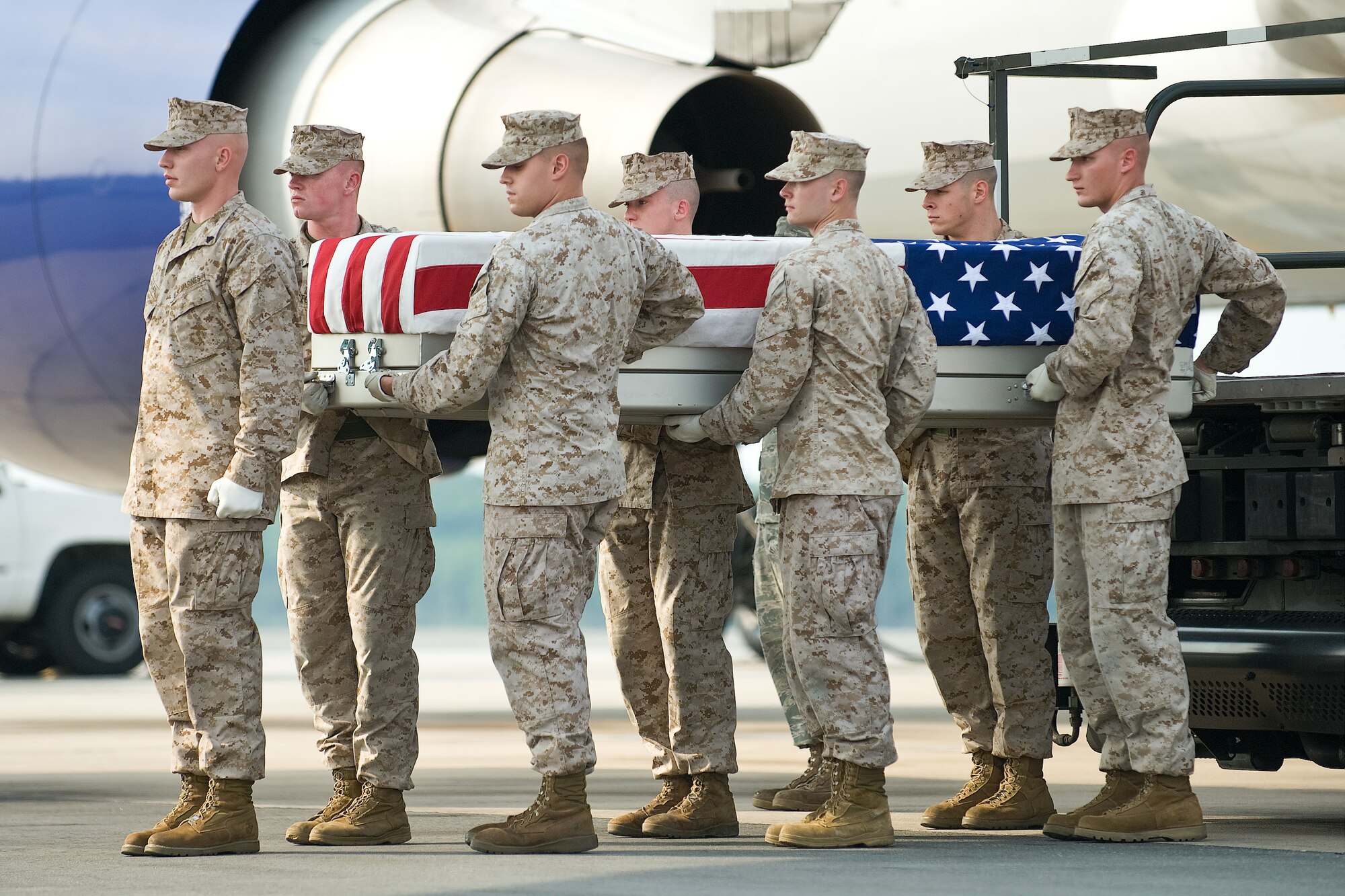 A U.S. Marine Corps team transfers the remains of Marine Corps Lance Cpl. Cody S. Childers, of Chesapeake, Va., at Dover Air Force Base, Del., August 21. Lance Cpl. Childers was assigned to 2nd Battalion, 6th Marine Regiment, 2nd Marine Division, II Marine Expeditionary Force, Camp Lejeune, N.C.  (U.S. Air Force photo/Roland Balik)