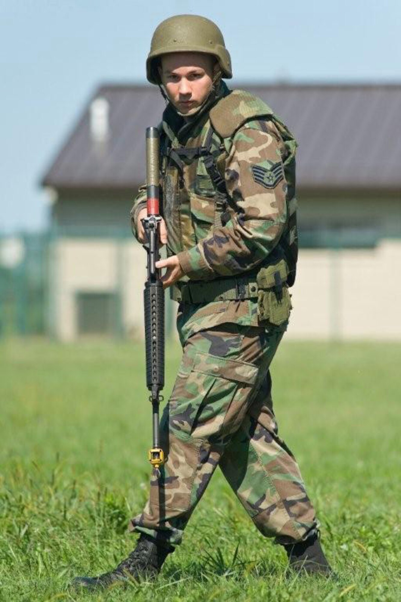 Armed with an M-16, Staff Sgt. Clint Cloonan, 436th Logistics Readiness Squadron, participates in an Expeditionary Combat Skills Training course on Dover Air Force Base, Del., Aug. 27, 2010. This training course fulfilled the predeployment requirement for 16 Airmen heading downrange. (U.S. Air Force photo by Roland Balik/Released)