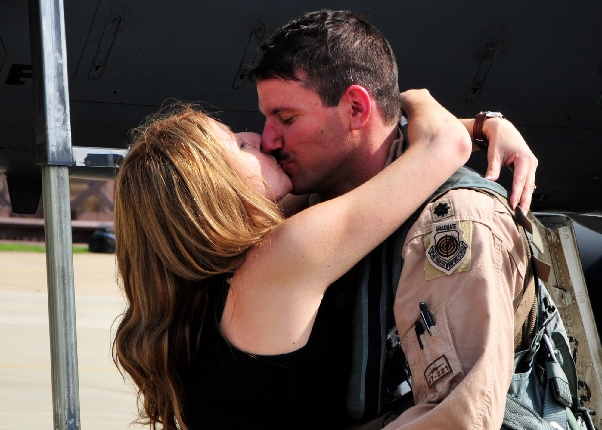 Lisa Mixon welcomes husband, Lt. Col. Clint Mixon, 492nd Fighter Squadron commander, upon his return from a four-month deployment to Bagram, Afghanistan on the RAF Lakenheath, England, flightline Sept. 1, 2010. Colonel Mixon piloted one of the six F-15s that returned. (U.S. Air Force photo/Airman 1st Class Tiffany Deuel)