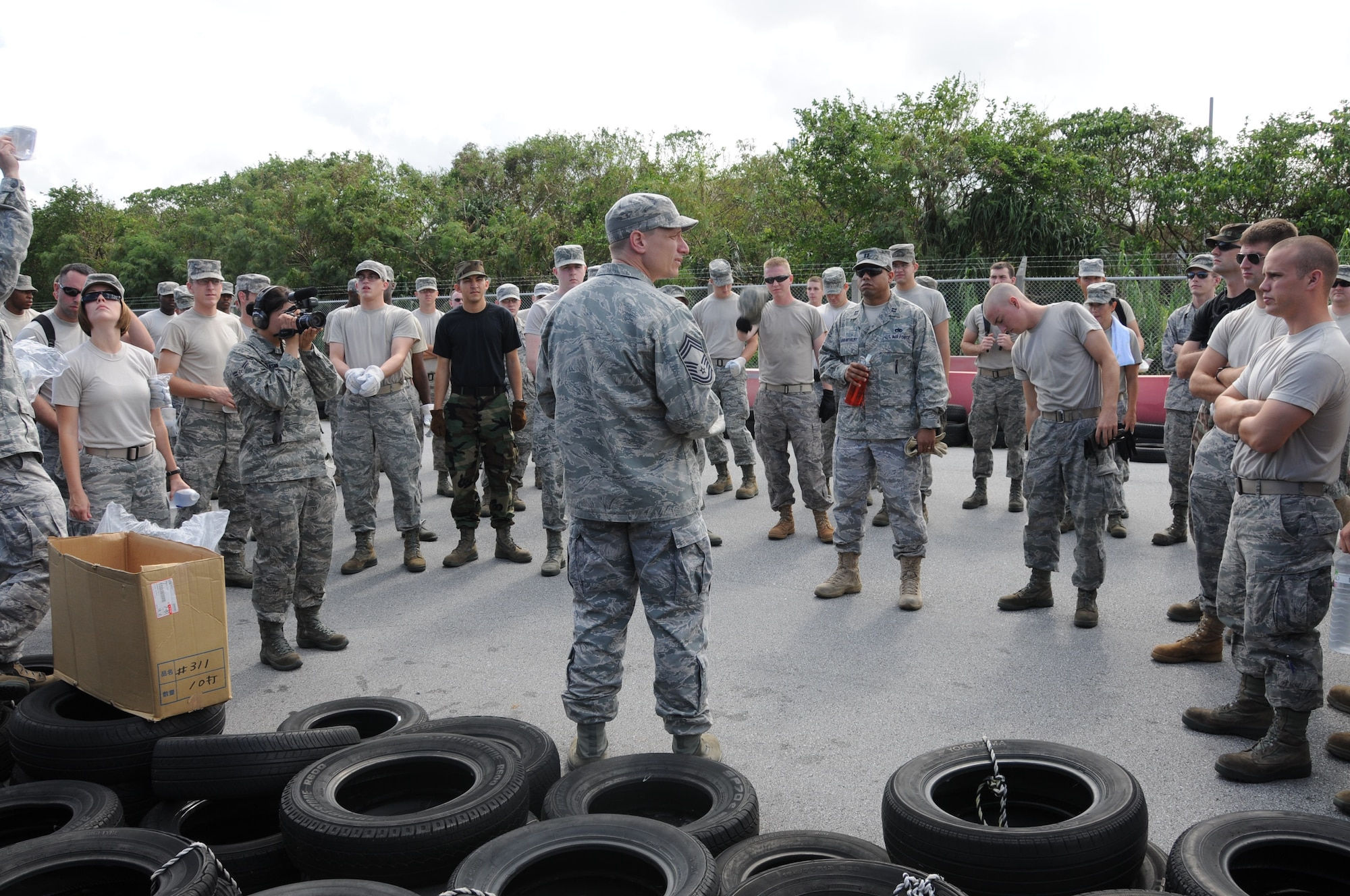 Airmen from the 18th Wing receive a safety briefing at Okuma Recreation Area, Sep. 2, 2010 prior to cleaning up damage caused by the recent typhoon. More than 100 Airmen from Kadena Air Base volunteered to help clean up the debris caused by typhoon Kompasu. (U.S. Air Force photo/Staff Sgt. Darnell T. Cannady)