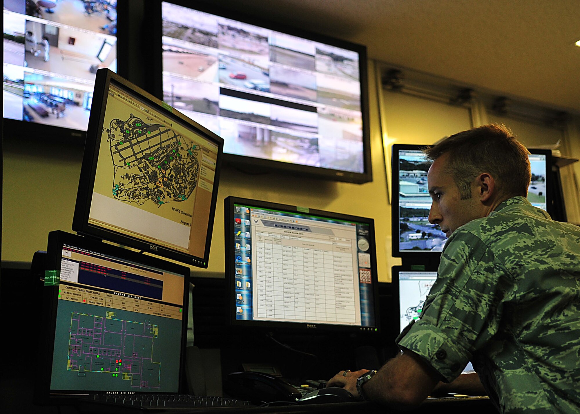 Airman Fabian Gosen, 18th Security Forces Squadron alarm monitor, watches an annunciator panel that monitors all of Kadena’s alarmed facilities, Aug. 26. The security forces squadron responds to all alarms on base and has recently teamed with the 18th Communications Squadron and 18th Civil Engineer Squadron to reduce false alarms. (U.S. Air Force photo/Staff Sgt. Alesia Goosic) 