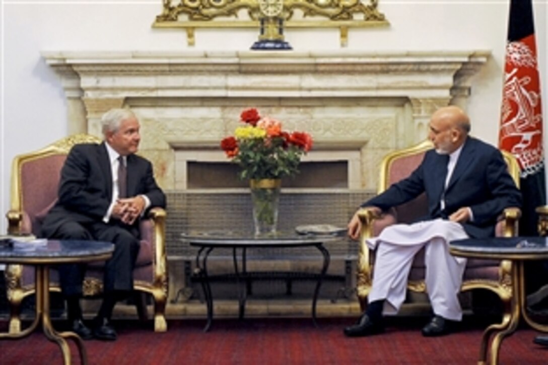 U.S. Defense Secretary Robert M. Gates talks with President Hamid Karzai at the Presidential Palace in Kabul, Afghanistan, Sept. 2, 2010.  