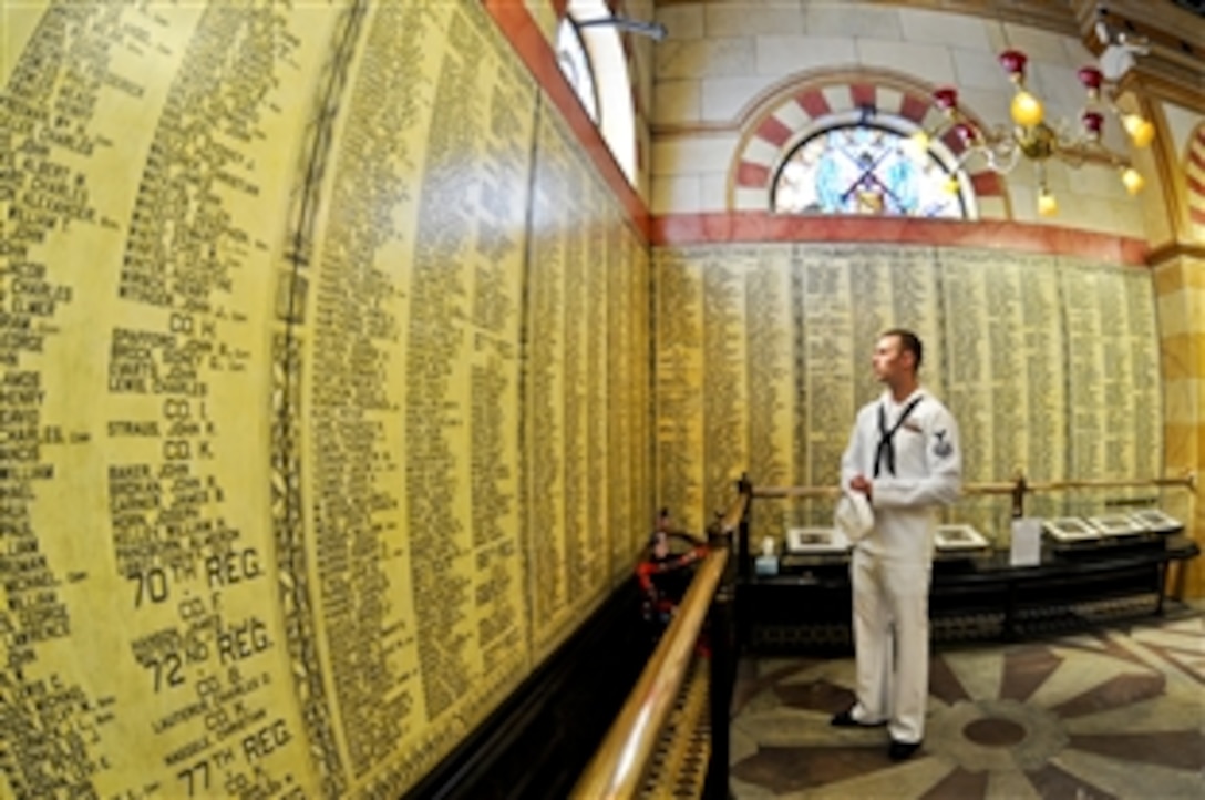 U.S. Navy Petty Officer 2nd Class Aaron Hammersmith studies the names of the 9,000 Civil War veterans who served with Cuyahoga County, Ohio, regiments in Cleveland, Aug. 31, 2010. Hammersmith, a machinist mate assigned to the guided-missile submarine USS Ohio, was on a tour to celebrate Cleveland Navy Week.