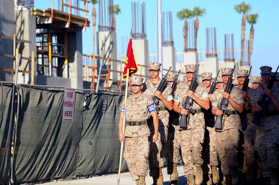 Company L recruits march by one of the ‘H-style’ barracks being built here, Sept. 1. The construction is part of $175 million awarded to the depot for upgrades, economic stimulus projects and the commandant’s Grow-the-Force initiative. Actual construction for the various projects began collectively in late spring and early summer and are slated for completion within 18 months.