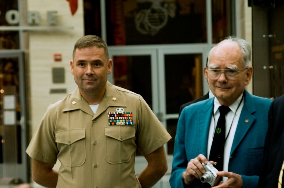 Lieutenant Col. Rex Sappenfield, the assistant chief of staff G-1, Marine Corps Recruiting Command,  is joined by his father, Dale Sappenfield, a former Marine officer, during his promotion ceremony at the National Museum of the Marine Corps, Triangle, Va., Sept. 3. Sappenfield joined the Marine Corps after his father, a Marine during the 1950s, surprised him with a recruiter one day after school.