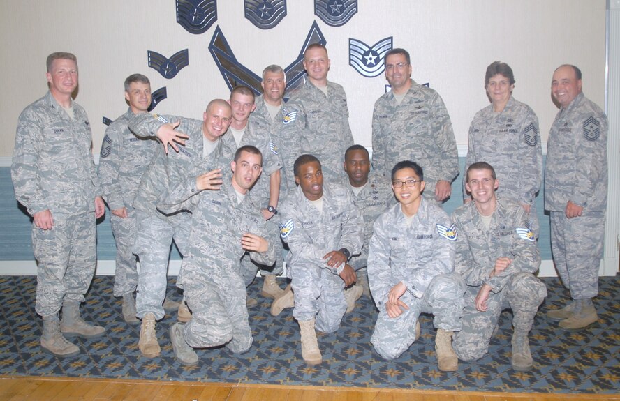 KUNSAN AIR BASE, Republic of Korea -- Members of the 8th Communications Squadron celebrate their selection for promotion to staff sergeant Aug. 27. Approximately 215 Wolf Pack senior airmen were selected Aug. 19 to pin on the rank. (U.S. Air Force photo/Senior Airman Ciara Wymbs)