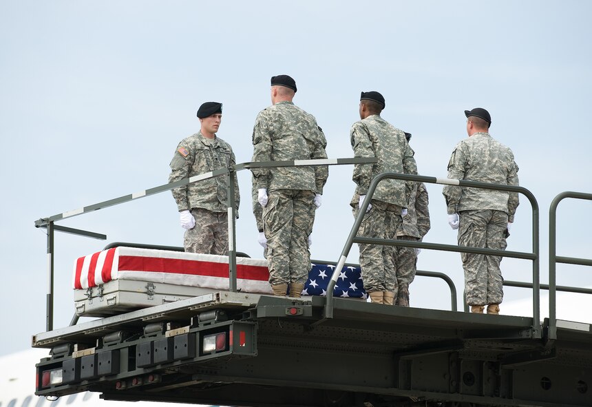 17 August 2010  USAF Photo by Jason Minto.  A U.S. Army carry team transfers the remains of Army SPC Jamal M. Rhett of Palmyra, NJ at Dover Air Force Base, Del., August 17, 2010.