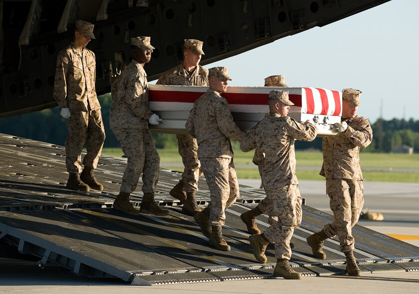 14 August 2010  USAF Photo by Jason Minto.  A U.S. Marine Corps carry team transfers the remains of Marine Cpl Kristopher D. Greer of Ashland City, TN., at Dover Air Force Base, Del., August 14, 2010.