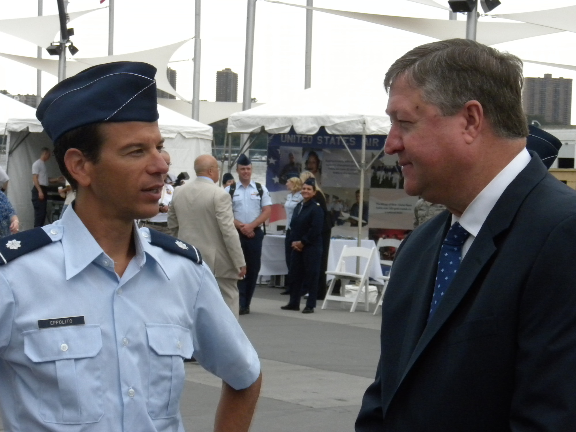 Lt. Col. (Dr.) Antonio Eppolito, chief of AF Telemedicine, left, discusses
the AF Virtual Reality Exposure Therapy Program entitled "Virtual Iraq" with
Secretary of the Air Force Michael B. Donley outside the Air Force
Telehealth booth during AF Week New York City Aug. 23 on the Intrepid Sea,
Air & Space Museum's 86th Street Pier.  "Virtual Iraq" involves exposing
patients to a virtual world that simulates the sources of combat stress.  By
gradually reintroducing the patient to the experiences that triggered the
trauma, the memory becomes tolerable.  Roughly 8,000 people visited the AF
displays.
(U.S. Air Force photo by Bart Delphin)
