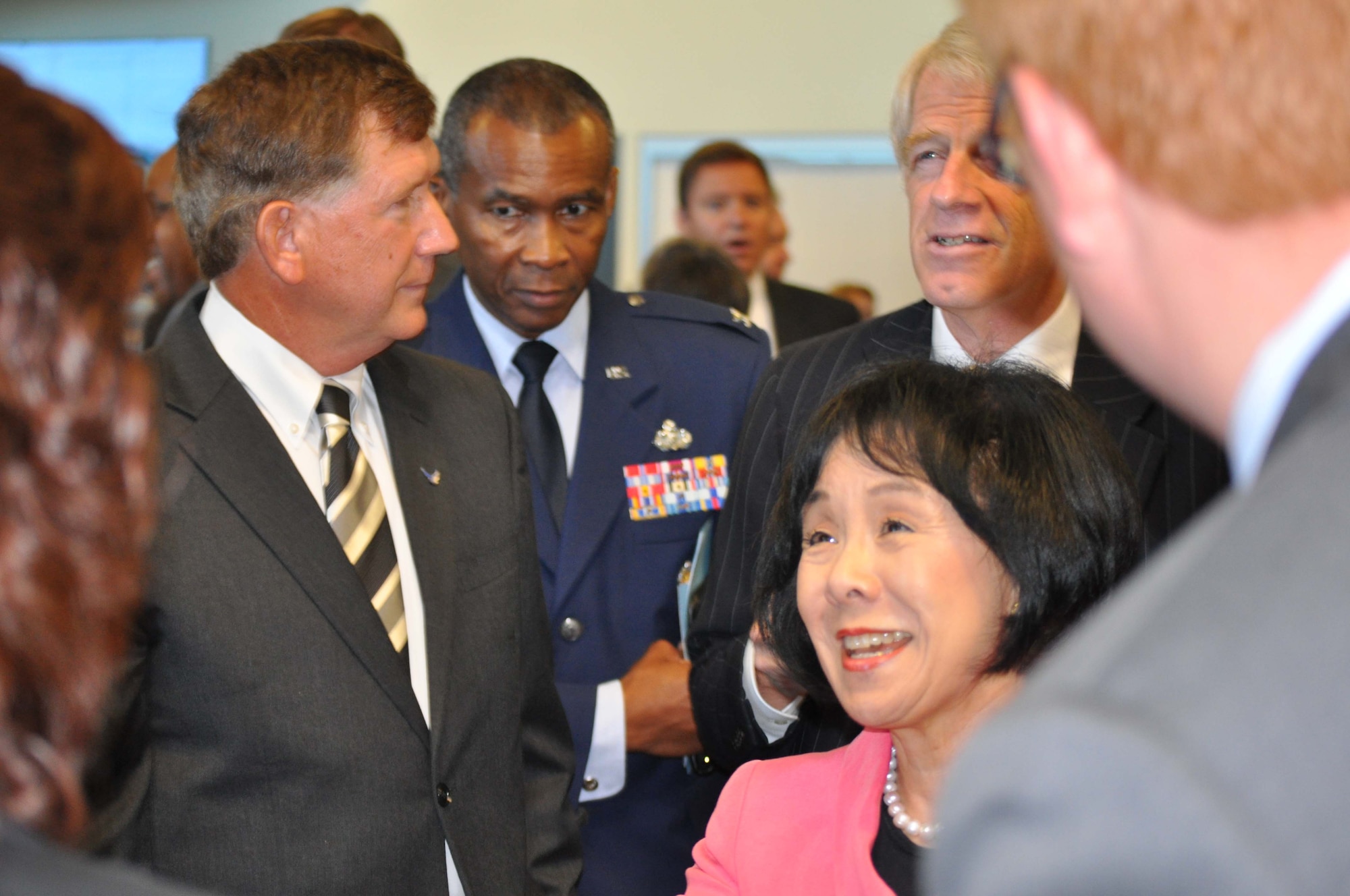 Terry Yonkers (left), Assistant Secretary of the Air Force for Installations, Environment and Logistics and California Congresswoman Doris Matsui greet community officials Aug. 12, 2010, following a ceremony to transfer some 560 acres of the former McClellan Air Force Base in Sacramento, Calif., to McClellan Business Park under an innovative early transfer and privatized cleanup agreement. (Photo by Tim Huyhn)
